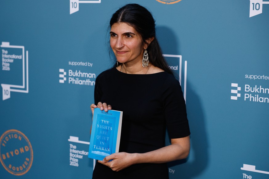 epa12975496 Shida Bazyar, author of 'The Nights Are Quiet in Tehran,' poses at the 2026 International Booker Prize at the Tate Modern, in London, Britain, 19 May 2026. The International Book ...