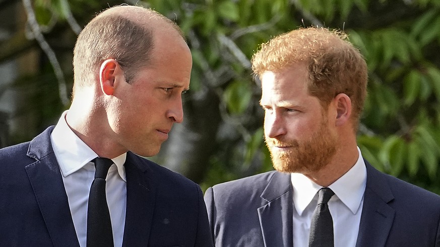 FILE - Britain&#039;s Prince William and Britain&#039;s Prince Harry walk beside each other after viewing the floral tributes for the late Queen Elizabeth II outside Windsor Castle, in Windsor, Englan ...