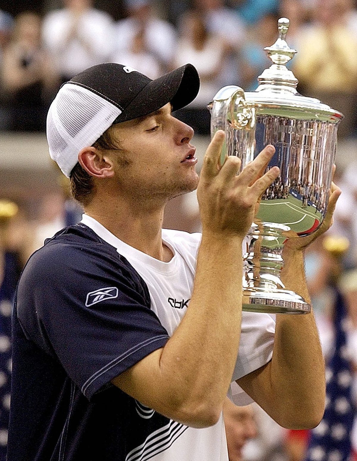 Andy Roddick of the US kisses the US Open trophy after the men's final Sunday 07 September, 2003 at the US Open in Flushing Meadows, NY. EPA PHOTO/EPA/Rhona WISE//