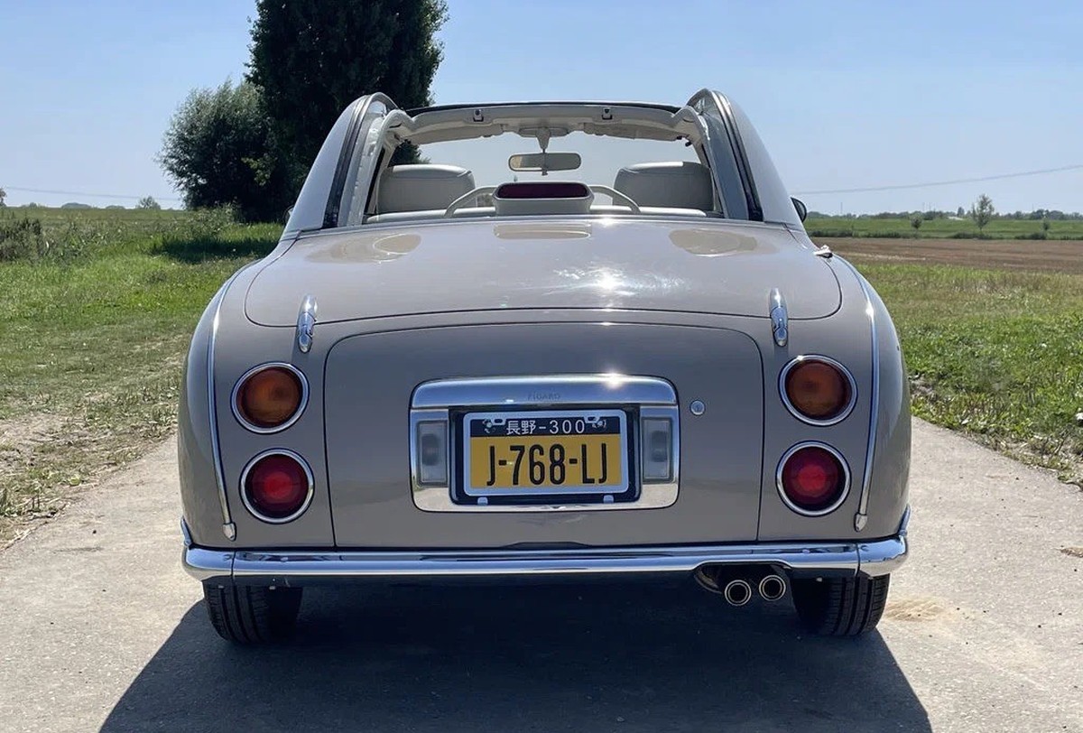 1991 Nissan Figaro 
https://www.route66auctions.com/product/nissan-figaro-1991-n8658-5/