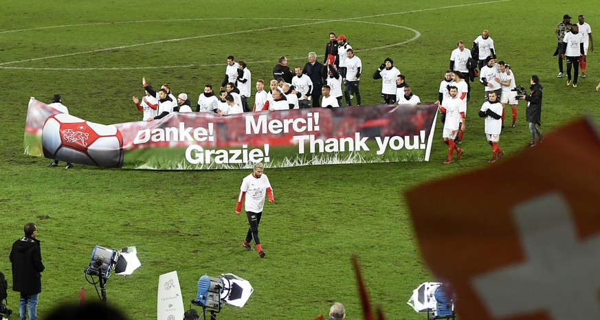 Switzerland&#039;s players celebrate with a banner their qualifying for the 2018 FIFA World Cup Russia after beating Northern Ireland, during the 2018 Fifa World Cup play-offs second leg soccer match  ...