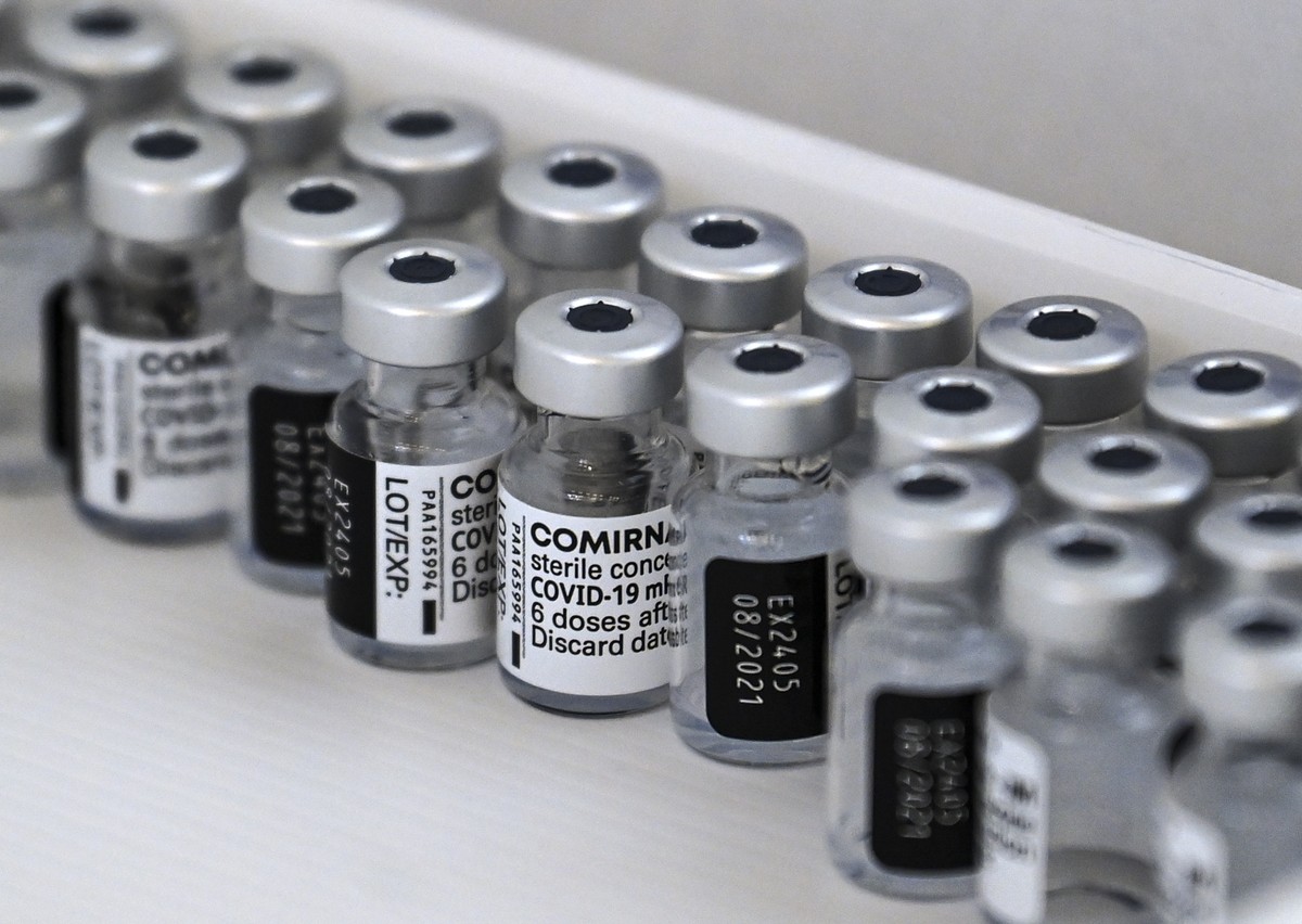 epa09154598 Empty bottles of of Pfizer-BioNTech COVID-19 vaccine seen in the box during the vaccination at the Arena 'Boris Trajkoovski' in Skopje, Republic of North Macedonia, 23 April 2021 ...