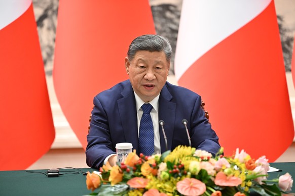 China's President Xi Jinping speaks during a joint press conference with France's President Emmanuel Macron at the Great Hall of the People in Beijing Thursday, Dec. 4, 2025. (Adek Berry/Poo ...