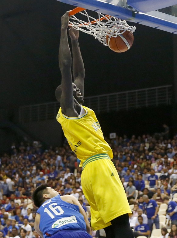 Australia's Thon Marial Maker scores a slam over the Philippines' Roger Ray Pogoy during the FIBA World Cup Qualifiers Monday, July 2, 2018 at the Philippine Arena in suburban Bocaue townshi ...