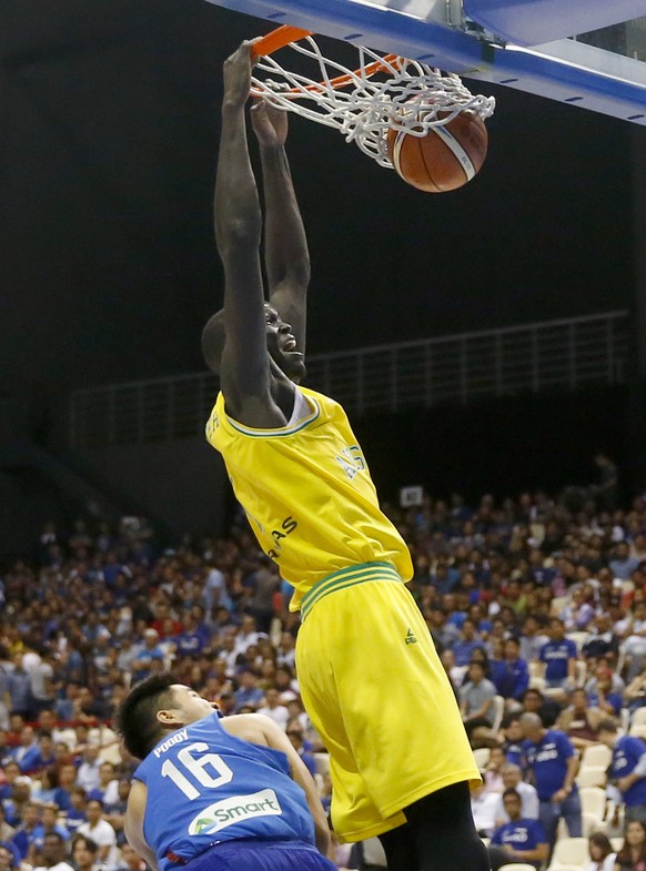 Australia&#039;s Thon Marial Maker scores a slam over the Philippines&#039; Roger Ray Pogoy during the FIBA World Cup Qualifiers Monday, July 2, 2018 at the Philippine Arena in suburban Bocaue townshi ...