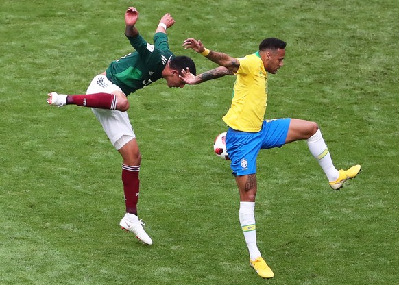 epa06858008 Neymar (R) of Brazil in action against Edson Alvarez (L) of Mexico during the FIFA World Cup 2018 round of 16 soccer match between Brazil and Mexico in Samara, Russia, 02 July 2018.

(RE ...