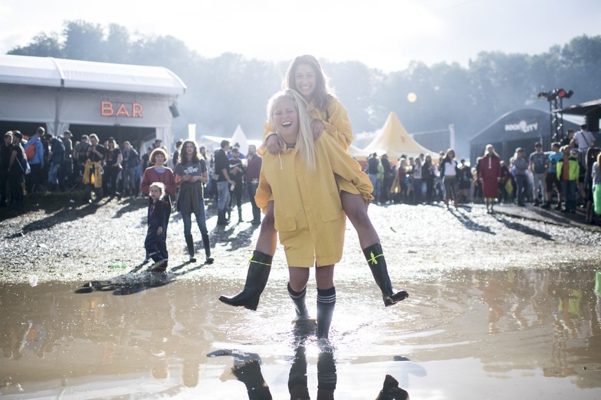 Festival visitors jumps in the mud during the music festival Openair St. Gallen, on Friday, June 30, 2017. The festival will take place until Sunday, July 2, 2017. (KEYSTONE/Ennio Leanza)