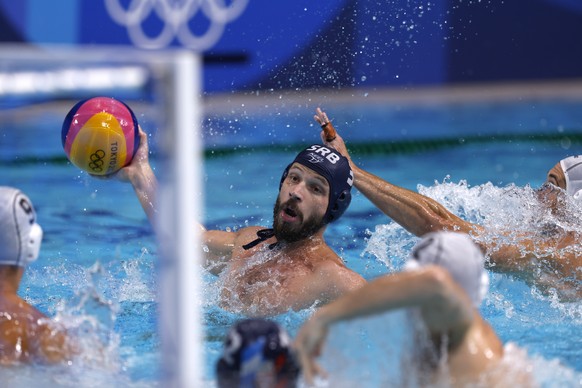 epa09405643 Nikola Dedovic of Serbia in action during the Men&#039;s Water Polo Gold medal match between Greece and Serbia at the Tokyo 2020 Olympic Games at the Tatsumi Water Polo Centre in Tokyo, Ja ...