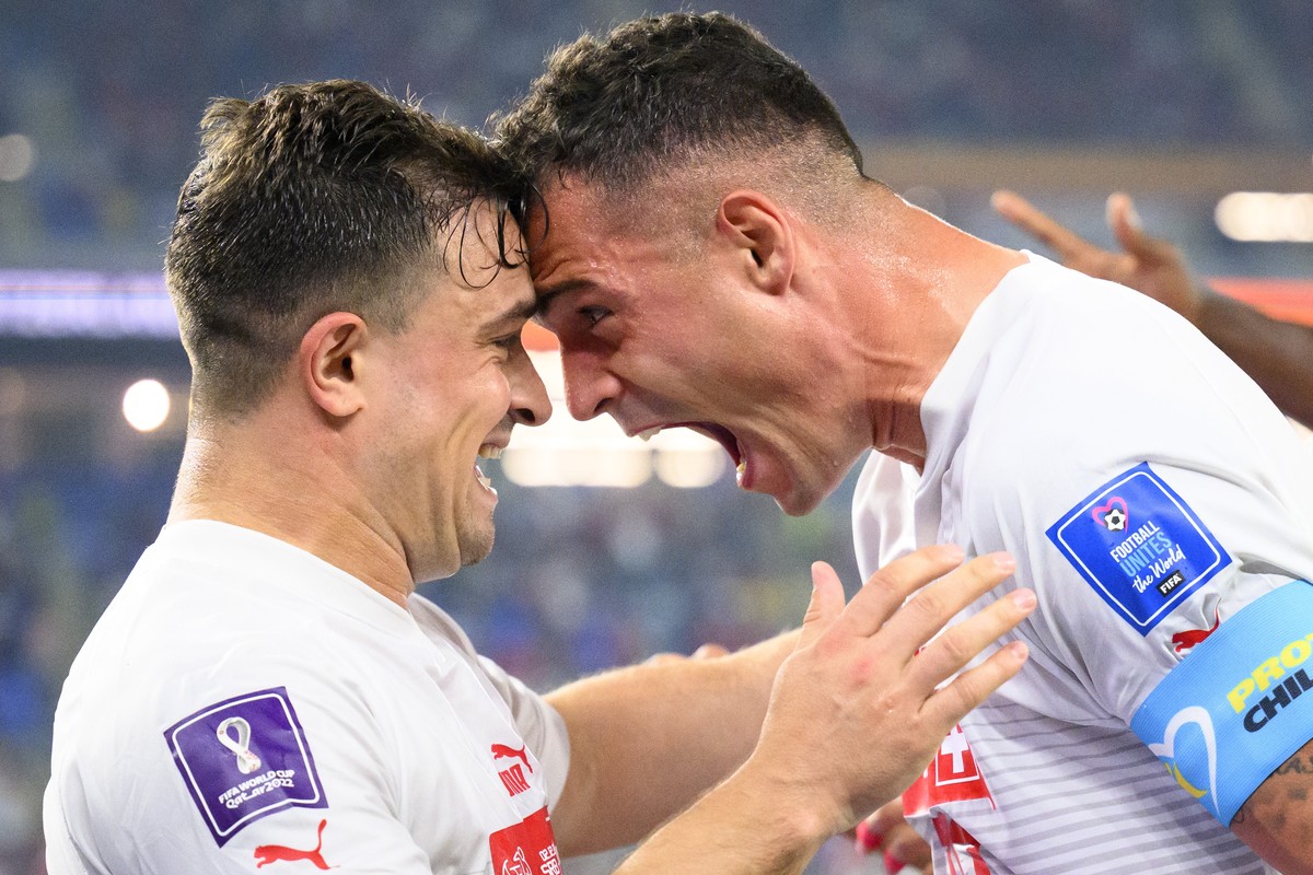 Switzerland's midfielder Xherdan Shaqiri, left, celebrates after scoring the first goal with Switzerland's midfielder Granit Xhaka, right, during the FIFA World Cup Qatar 2022 group G soccer ...