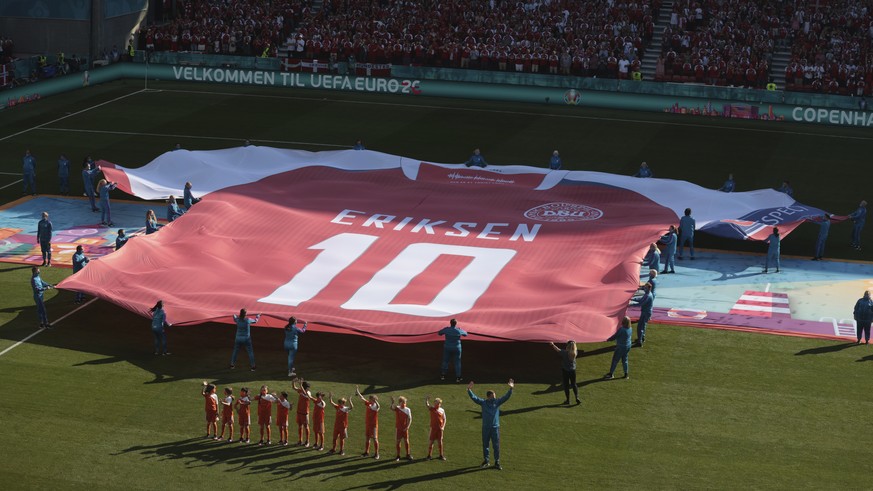 A giant jersey in support of Danish player Christian Eriksen is displayed ahead of the Euro 2020 soccer championship group B match between Denmark and Belgium at the Parken stadium in Copenhagen, Denm ...