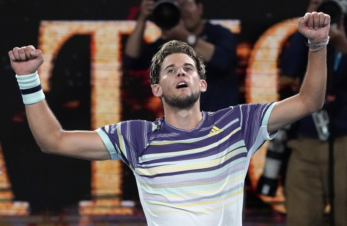 Austria's Dominic Thiem celebrates after defeating Germany's Alexander Zverev in their semifinal match at the Australian Open tennis championship in Melbourne, Australia, Friday, Jan. 31, 20 ...