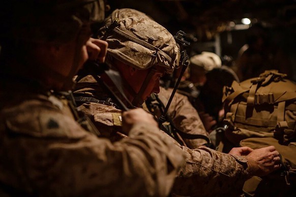 In this photo provided by U.S. Department of Defense, U.S. Marines assigned to Special Purpose Marine Air-Ground Task Force-Crisis Response-Central Command (SPMAGTF-CR-CC) 19.2, prepare to deploy from ...
