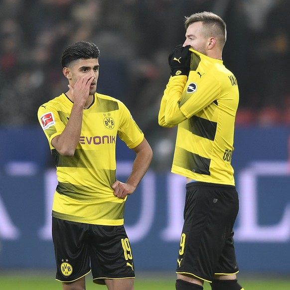 FILE - In this Dec. 2, 2017 file photo Dortmund&#039;s Mahmoud Dahoud, left and Dortmund&#039;s Andrey Yarmolenko stand on the pitch disappointed after the German Bundesliga soccer match between Bayer ...