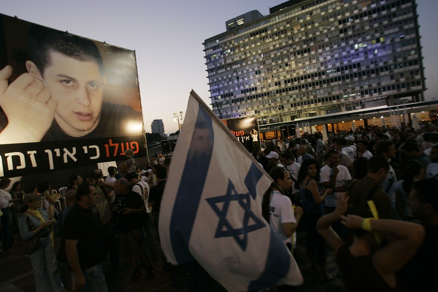 FILE - Israelis attend a demonstration calling for the release of kidnapped Israeli soldier Gilad Shalit, July 22, 2008, in Tel Aviv, Israel.  Hamas militants seized Shalit in a cross-border attack in June…