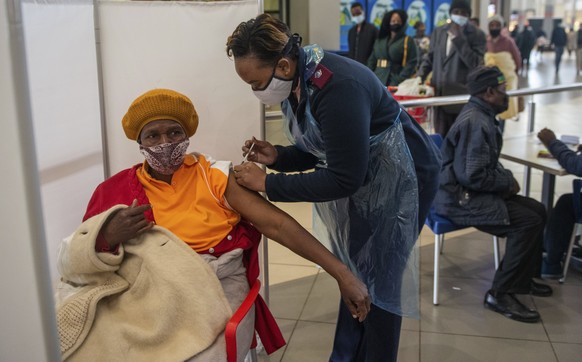 A patient is vaccinated against COVID-19 in Hammanskraal, South Africa, Tuesday, July 6, 2021. New vaccination centres are being opened as South Africa's resurgence of COVID-19 is setting record numbe ...