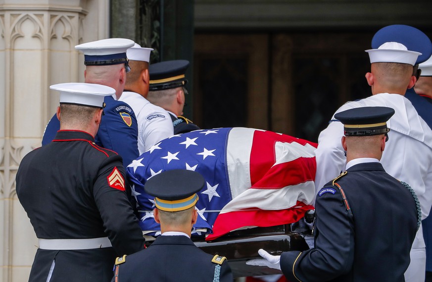 epa06990159 A military honor guard carries the casket as the family looks on during the funeral service for Senator John McCain at the Washington National Cathedral in Washington, DC, USA, 01 Septembe ...