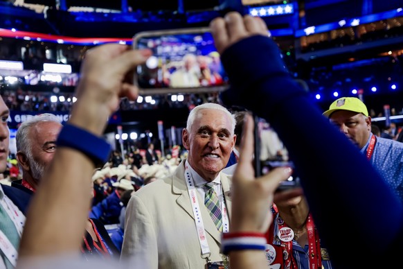 epa11484585 Conservative consultant Roger Stone (C) attends the third day of the Republican National Convention (RNC) at Fiserv Forum in Milwaukee, Wisconsin, USA, 17 July 2024. The convention comes d ...