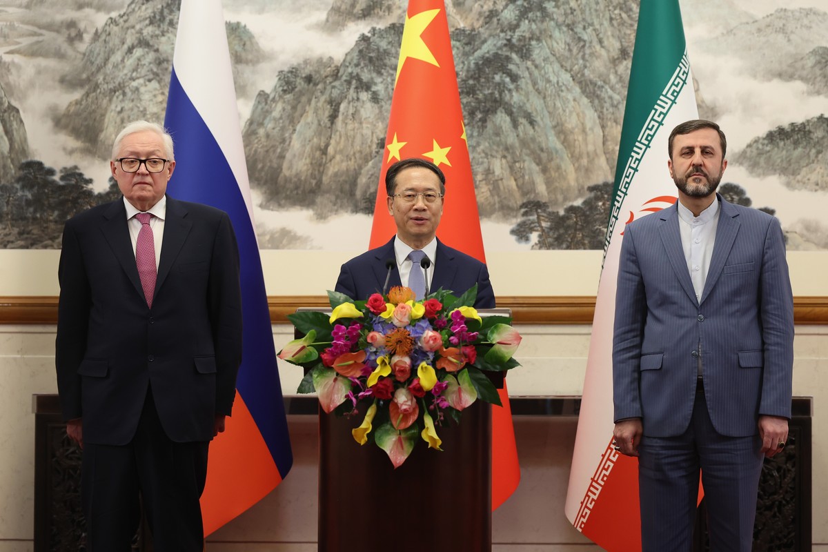 epa11962929 (L-R) Russian Deputy Foreign Minister Sergei Ryabkov, Chinese Vice Foreign Minister Ma Zhaoxu and Iranian Deputy Foreign Minister Kazem Gharibabadi hold a press conference after their talk ...