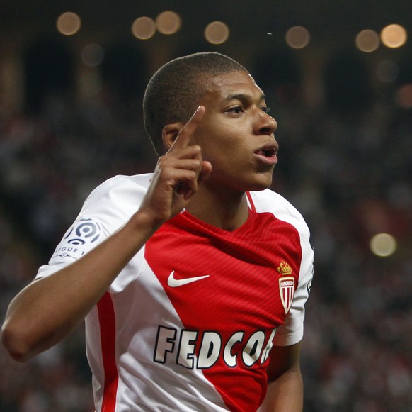 FILE - In this Wednesday, May 17, 2017 file photo, Monaco&#039;s forward Kylian MBappe Lottin celebrates his opening goal during the League One soccer match Monaco against Saint Etienne, at the Louis  ...