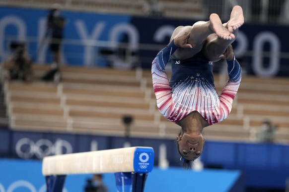 Simone Biles, of the United States, dismounts from the balance beam during the artistic gymnastics women&#039;s apparatus final at the 2020 Summer Olympics, Tuesday, Aug. 3, 2021, in Tokyo, Japan. (AP ...