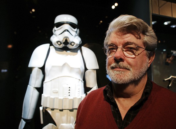 FILE - In this Oct. 22, 2005 file photo, filmmaker George Lucas poses in front of a Stormtrooper exhibit at the Museum of Science in Boston, prior to the opening of &quot;Star Wars: Where Science Meet ...