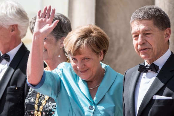 epa04859929 German Chancellor Angela Merkel (2-R) and her husband Joachim Sauer arrive for the opening of the 104th Bayreuth Festival at the Richard-Wagner-Festspielhaus (Bayreuth Festspielhaus), in B ...