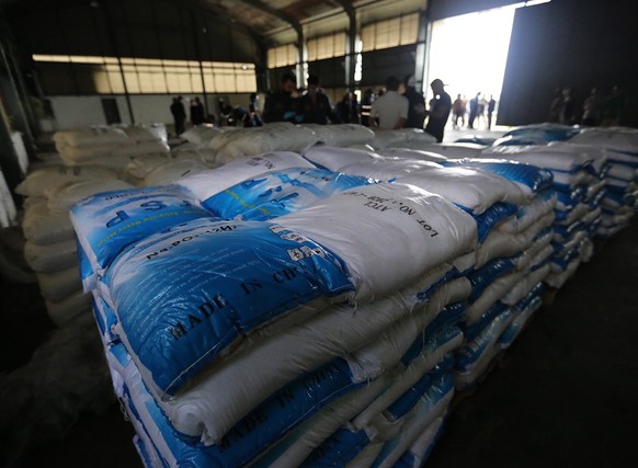 epa08816059 A handout photo made available by the Office of Narcotics Control Board (ONCB) shows the Thai police officers and relevant authorities inspect after seized Ketamine inside a warehouse at B ...