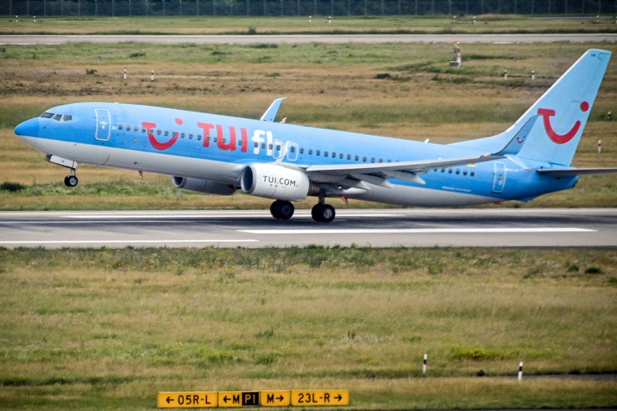 epa08485978 A Boeing 737-800 aircraft of German carrier TUIfly takes off from the international airport in Duesseldorf, Germany, early 15 March 2020. Since the travel restrictions in Germany began, th ...