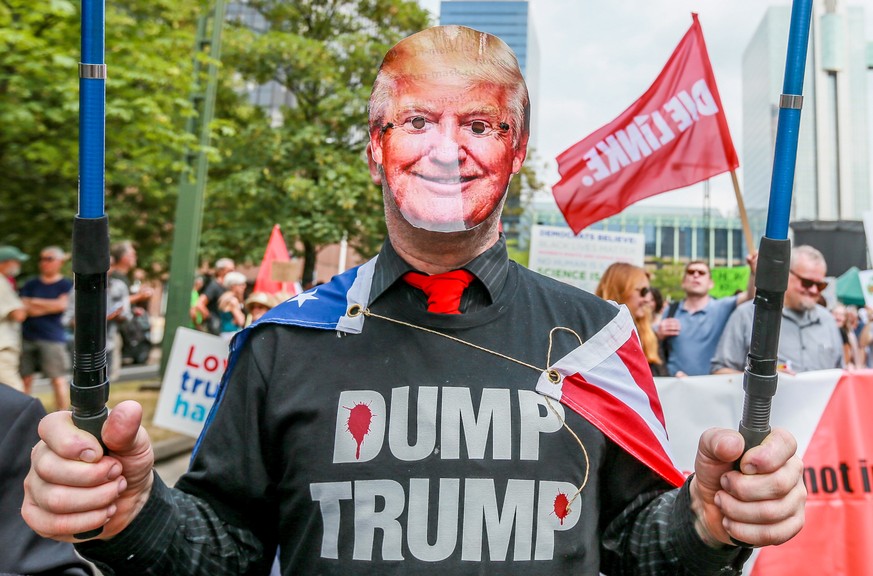 epa06871415 People take part in the demonstration for peace and against the US President Donald Trump, who is expected to attend a NATO summit in Brussels, Belgium, 07 July 2018. The protesters are as ...