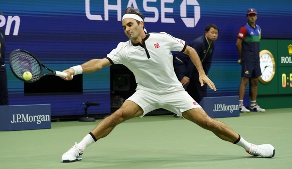 epa07800009 Roger Federer of Switzerland hits a return to Damir Dzumhur of Bosnia and Herzegovina during their match on the third day of the US Open Tennis Championships the USTA National Tennis Cente ...