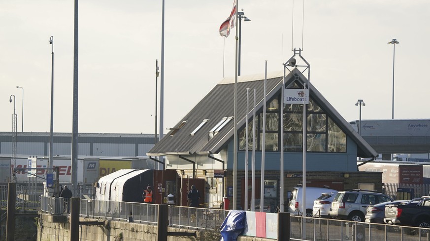 Forensic tents erected at the RNLI station at the Port of Dover, Wednesday Dec. 14, 2022, following a large search and rescue operation launched in the Channel off the coast of Dungeness, in Kent foll ...
