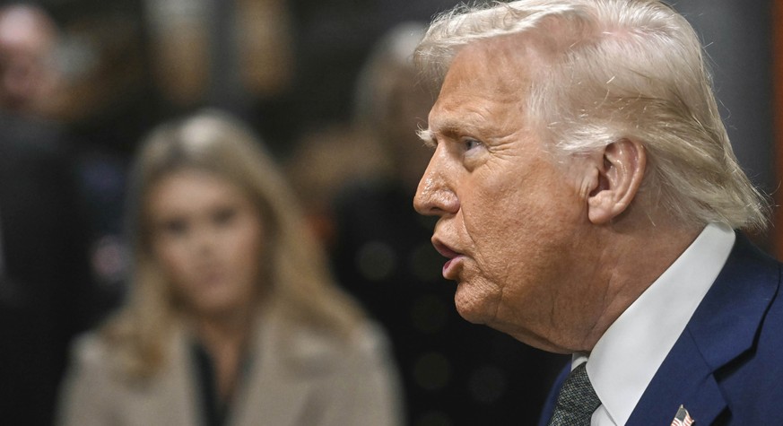 President Donald Trump talks with reporters as he visits the John F. Kennedy Center for the Performing Arts in Washington, Monday, March 17, 2025. (Pool via AP)
Trump