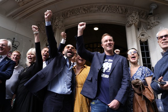 Former traders Tom Hayes, right, and Carlo Palombo, who were convicted of interest rate benchmark manipulation in 2015 and 2019 respectively, pose for media outside the UK Supreme Court in central Lon ...
