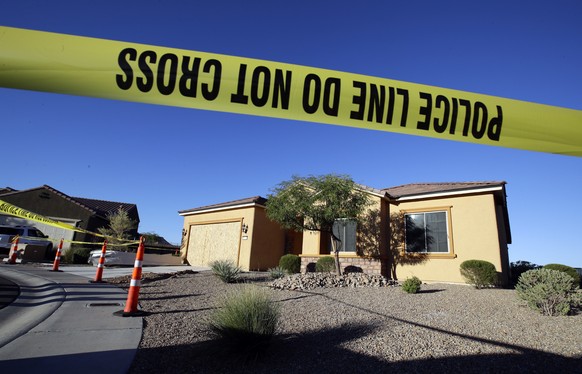 Police tape blocks off the home of Stephen Craig Paddock on Monday, Oct. 2, 2017, in Mesquite, Nev. Paddock killed dozens and injured hundreds on Sunday night when he opened fire at an outdoor country ...