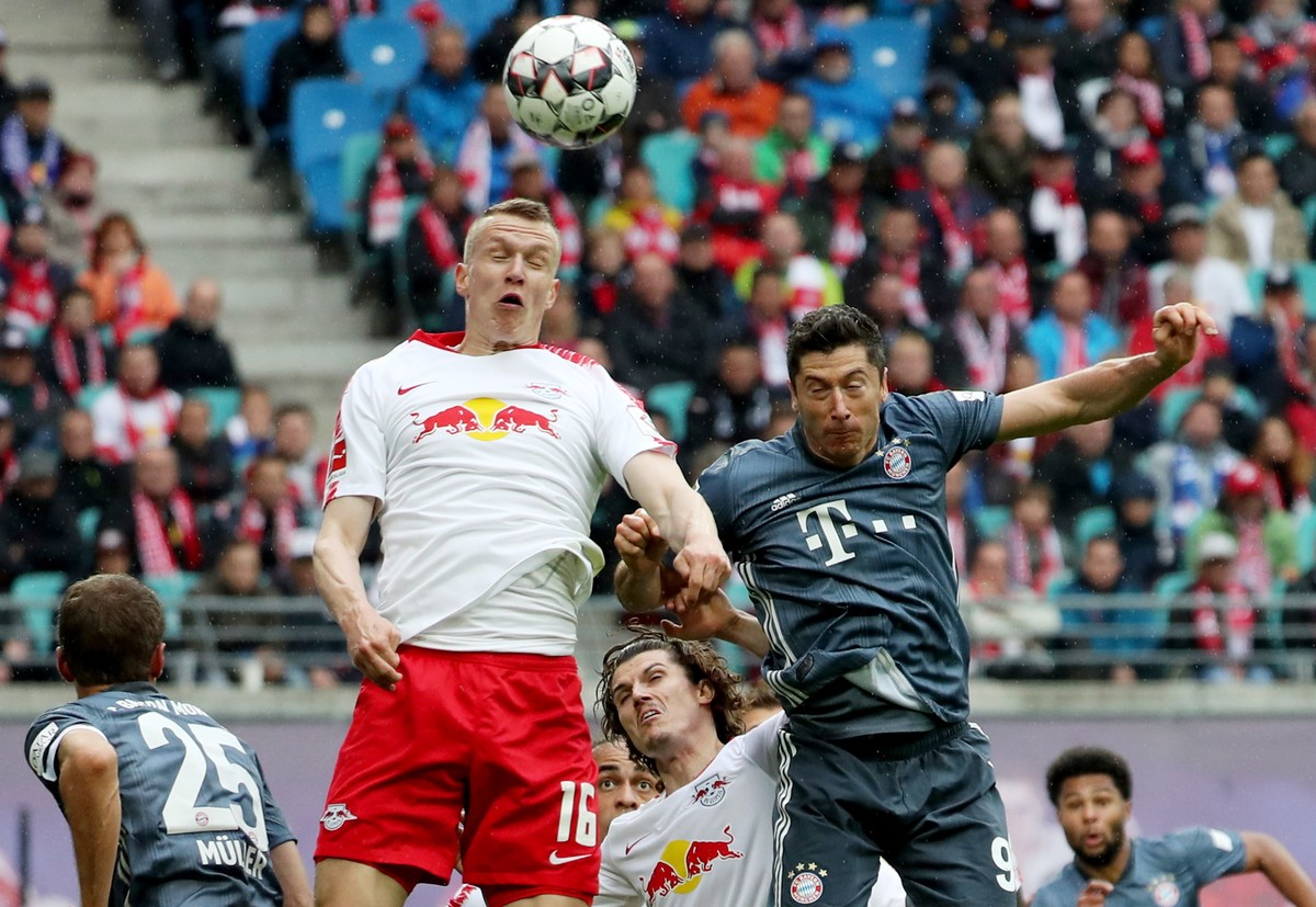 epa07562443 (L-R) Bayern's Thomas Mueller, Leipzig's Lukas Klostermann, Leipzig's Marcel Sabitzer, Bayern's Robert Lewandowski and Bayern's Serge Gnabry in action during the G ...