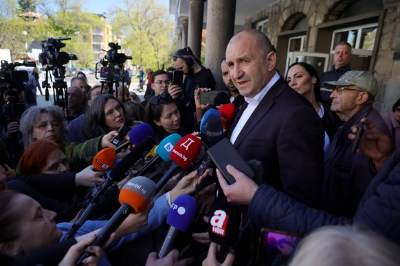Former Bulgarian President Rumen Radev speaks to journalists after casting his vote at a polling station in Sofia, Bulgaria, Sunday, April 19, 2026, during early parliamentary elections. (AP Photo/Val ...