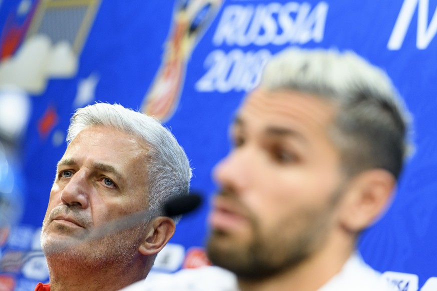 Switzerland&#039;s midfielder Valon Behrami, right, and Switzerland&#039;s head coach Vladimir Petkovic, left, speak during a press conference on the eve of the FIFA World Cup 2018 group E preliminary ...