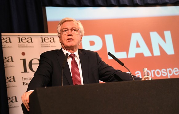 epa07043050 British MP and former Brexit Minister David Davis speaks at a briefing by the Institute of Economic Affairs (IEA) think tank in London, Britain, 24 September 2018. The IEA launched Plan A  ...