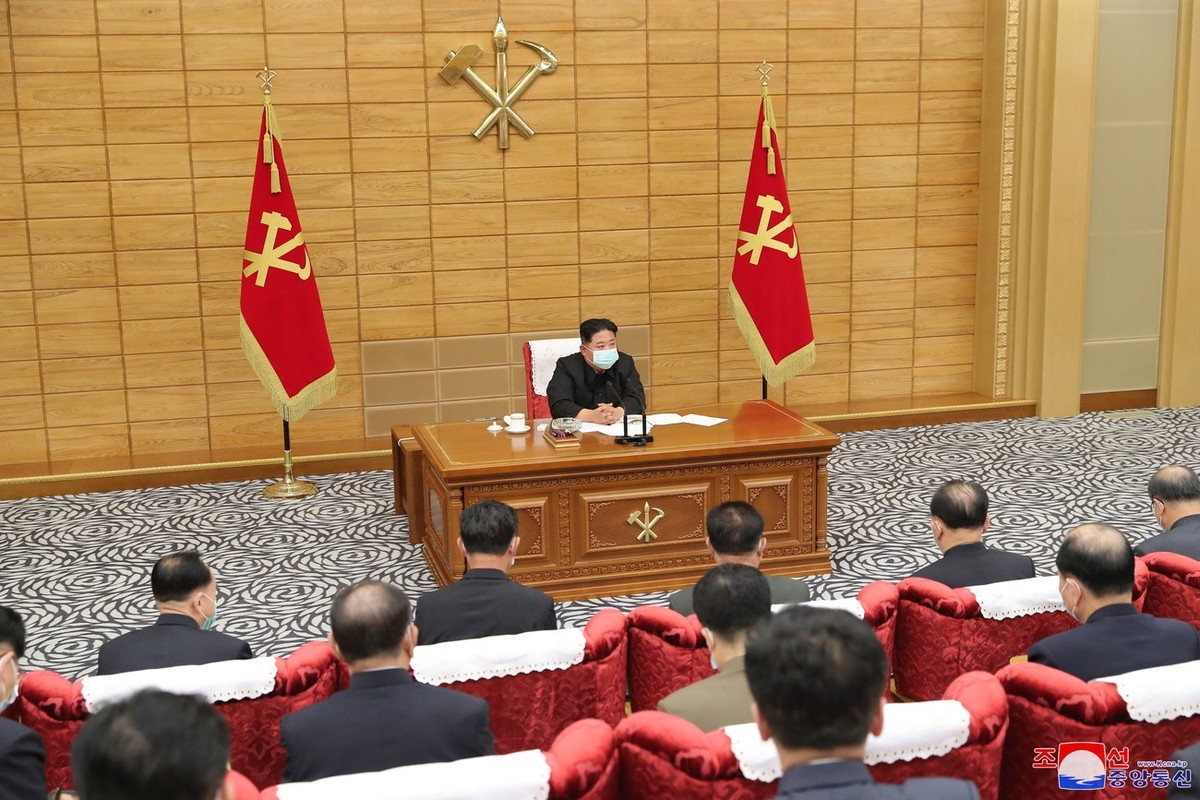 epa09946072 A photo released by the official North Korean Central News Agency (KCNA) shows Kim Jong Un (C), General Secretary of the Workers' Party of Korea, presiding over a conference of the Po ...