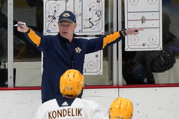 Nashville Predators head coach John Hynes talks with his team during NHL hockey training camp Friday, Sept. 23, 2022, in Nashville, Tenn. (AP Photo/Mark Humphrey)
John Hynes