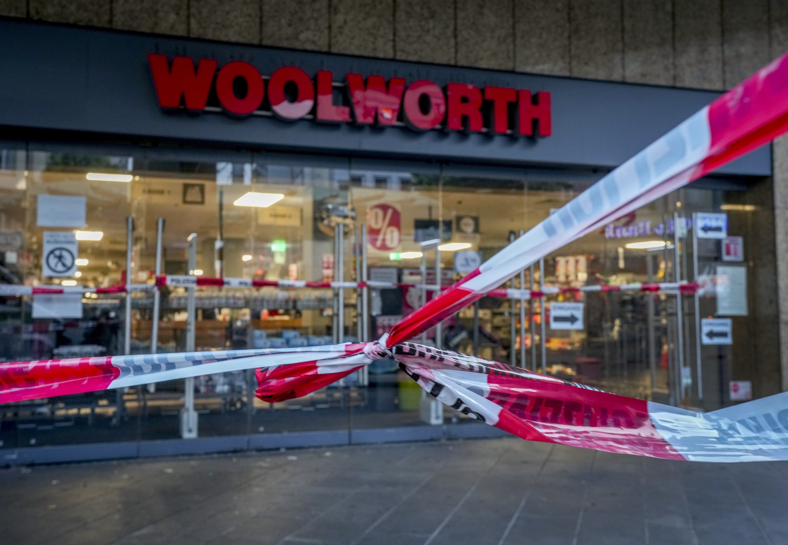 A crime scene tape is fixed in front of a Woolworth store in central Wuerzburg, Germany, Saturday, June 26, 2021. German police say several people have been killed and others injured in a knife attack ...