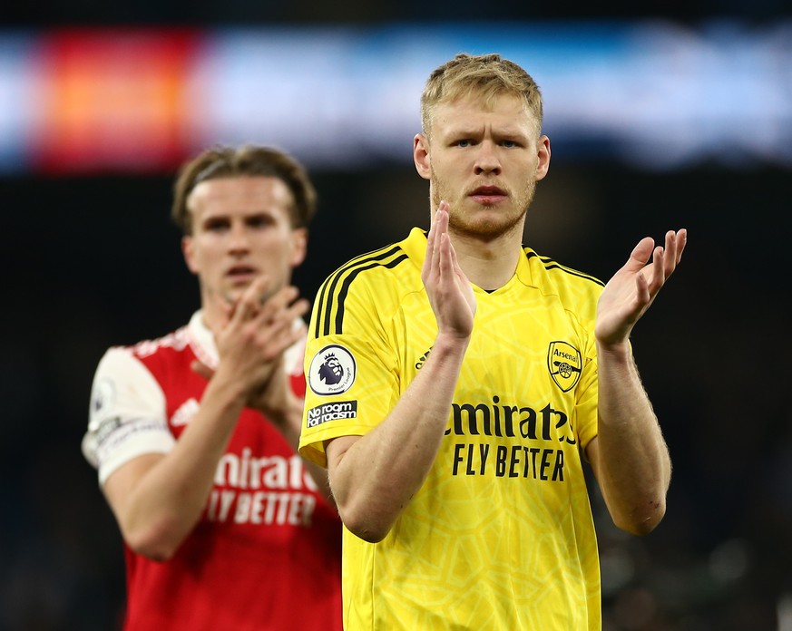 epa10593446 Aaron Ramsdale of Arsenal (R) reacts at full time after the English Premier League soccer match between Manchester City and Arsenal FC at the Etihad Stadium in Manchester, Britain, 26 Apri ...