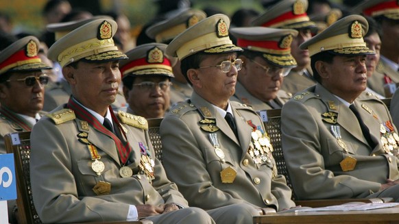 Myanmar junta leaders Gen. Thura Shwe, left, Lt. Gen. Thein Sein, center and Lt. Gen Kyaw Win, right, look on during 62nd annual Armed Forces Day ceremonies Tuesday, March 27, 2007, in the capital cit ...