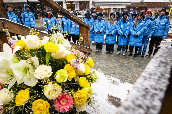 The Italian women ski team with Sofia Goggia, 3rd right, pay tribute to the victims front of the entrance of the "Le Constellation" bar after the fire at the "Le Constellation" bar ...