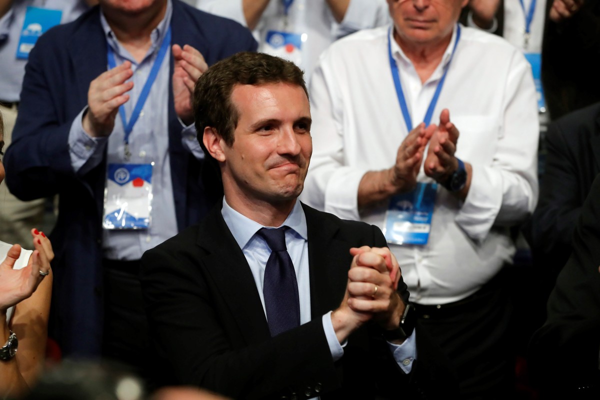 epa06902317 The newly-elected President of the Spanish conservative People's Party (PP), Pablo Casado (L), reacts during the People's Party (PP) national congress in Madrid, Spain, 21 July 2 ...