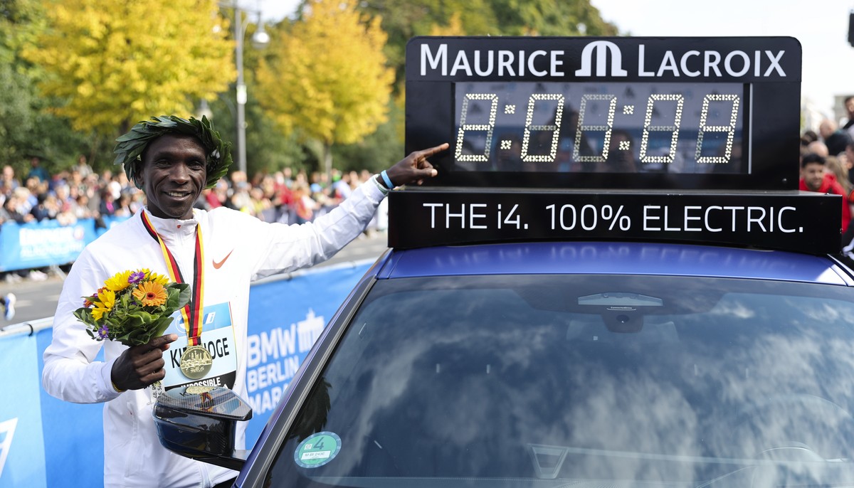 Kenya's Eliud Kipchoge poses for media after the winners ceremony for the Berlin Marathon in Berlin, Germany, Sunday, Sept. 25, 2022. Olympic champion Eliud Kipchoge has bettered his own world re ...
