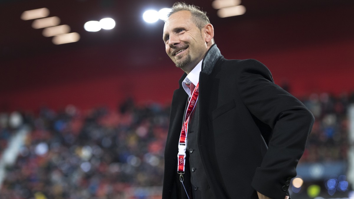 Switzerland's head coach Mauro Lustrinelli smiles before a qualification soccer match for the European Under 21 Championship between Switzerland and France at the Stadium Stade de la Maladiere, i ...