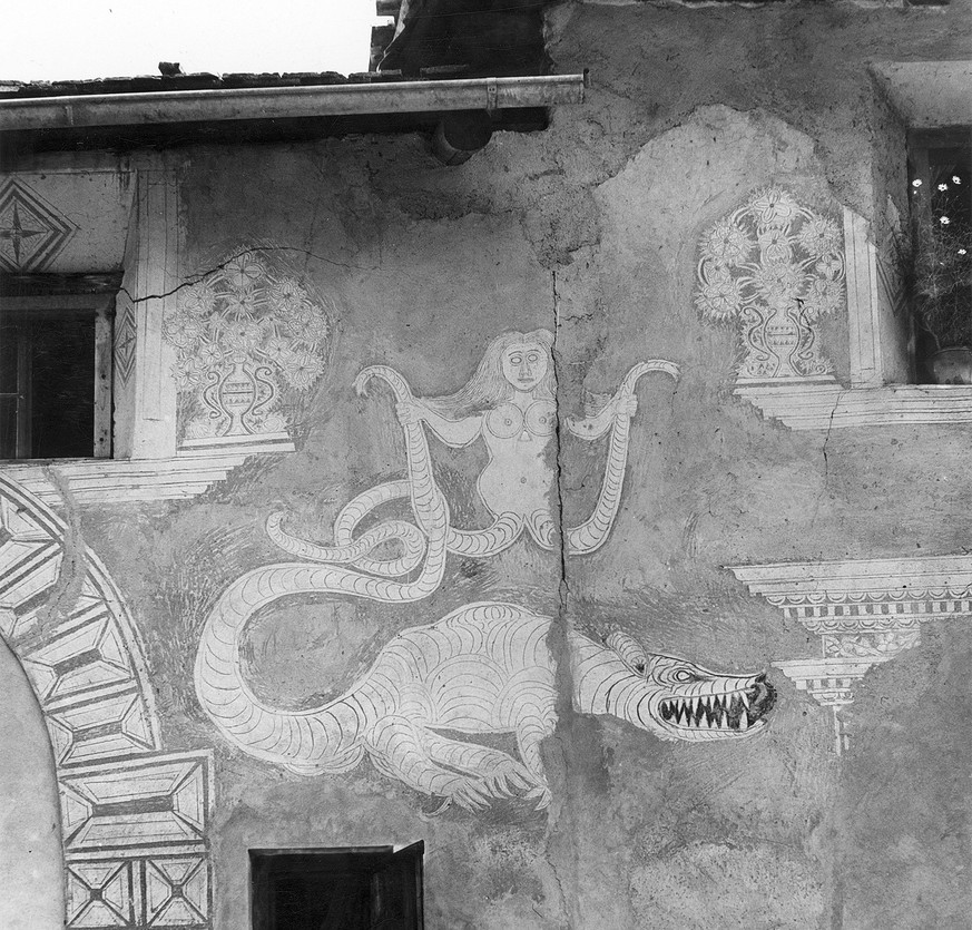 When Melusine wags the dragon: mythical creatures of legend can sometimes wander to the wall of a house and there in turn inspire imagination and oral tradition.  Sgrafitto jewelry on a ...