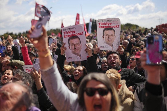 Supporters chant slogans as they gather outside Silivri Prison, where a hearing is taking place for Istanbul Mayor Ekrem Imamoglu in one of multiple cases against him, west of Istanbul, Turkey, Friday ...