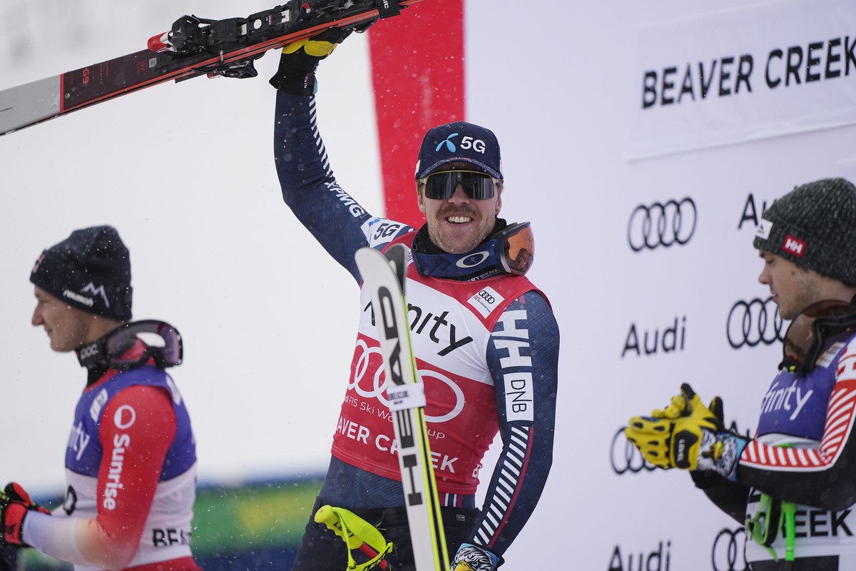Norway's Aleksander Aamodt Kilde, center, celebrates his first place finish during a men's World Cup downhill skiing race Saturday, Dec. 3, 2022, in Beaver Creek, Colo. (AP Photo/John Locher ...